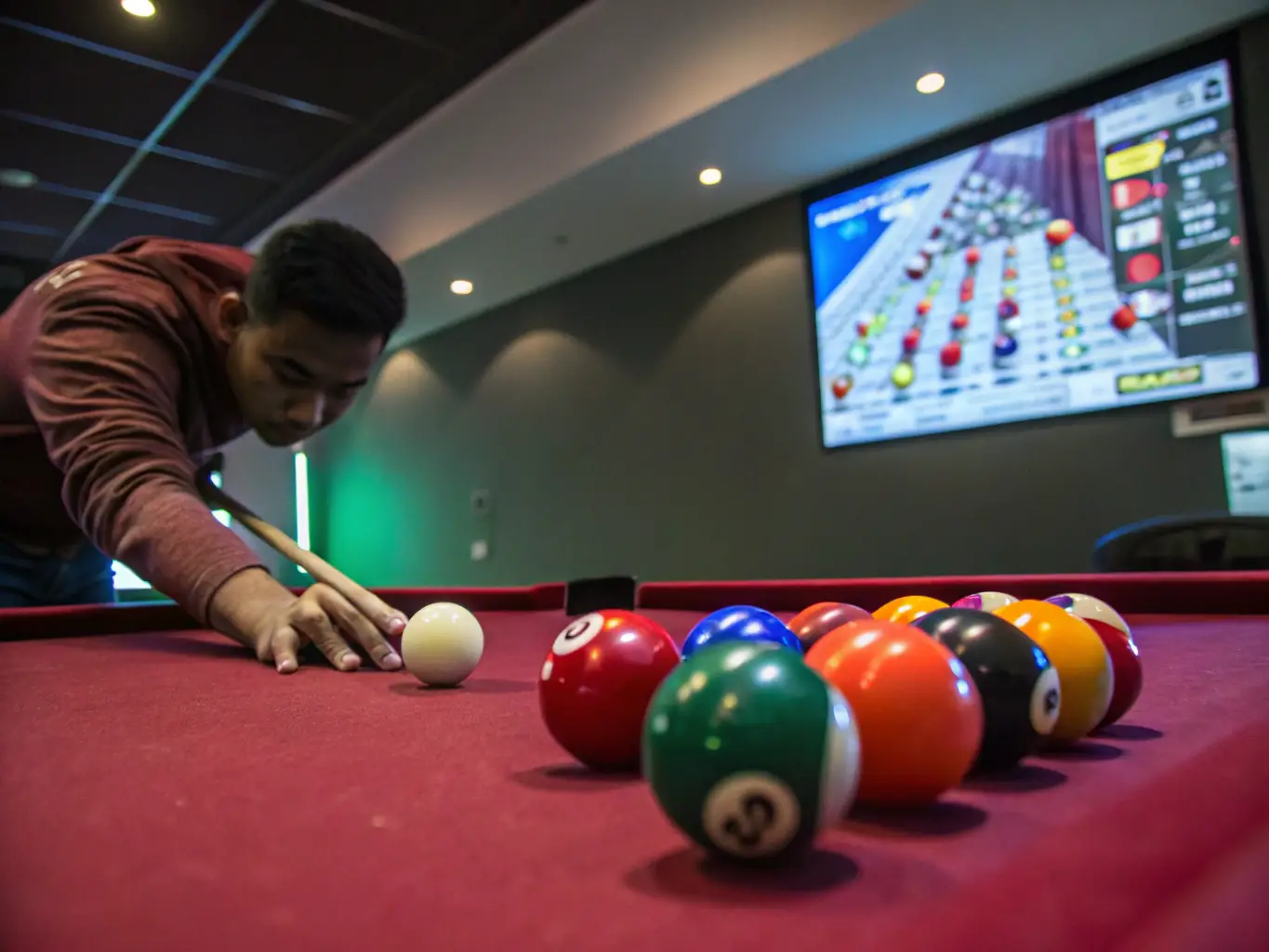 A focused billiards player practicing a precise shot during a training session at UNION BILLARD CLUB ROCHEFORT, showcasing the dedication and skill development involved in the club's programs.