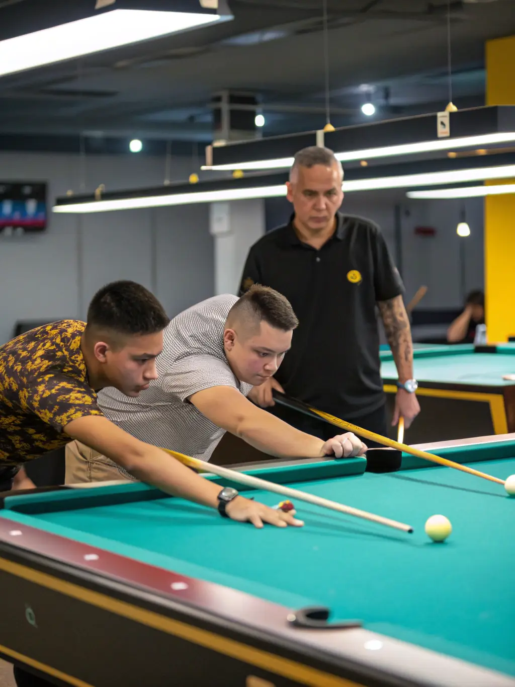 A group of billiards players participating in a workshop, learning new techniques and strategies together in a collaborative setting.